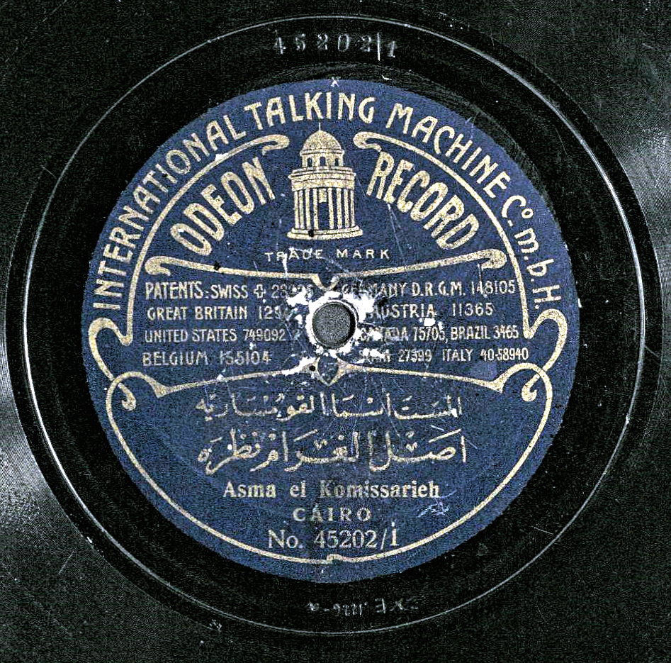 A blue paper record label in English and Arabic, reading "International Talking Machine Co. m.b.H. Odeon Record.