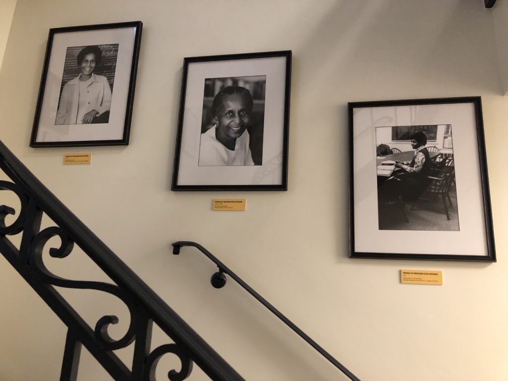 Three black-and-white framed photographs are mounted on a wall. They depict Professor Eileen Southern, a faculty member at Harvard University. Professor Southern was a Black woman.